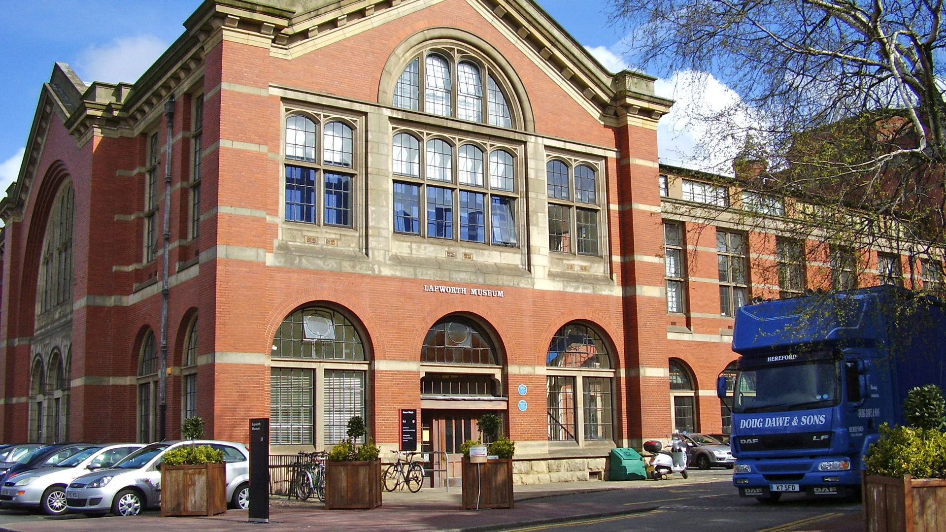 Exterior view of the Lapworth Museum of Geology at the University of Birmingham with its red-brick architecture.